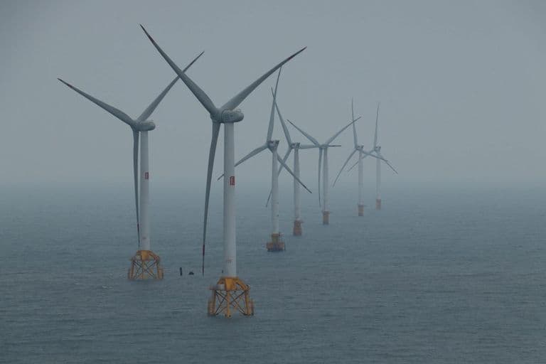 Offshore wind turbines generating clean energy in the ocean breeze.